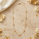 Collier Maëlle doré à neuf motifs ajourés sur décor beige